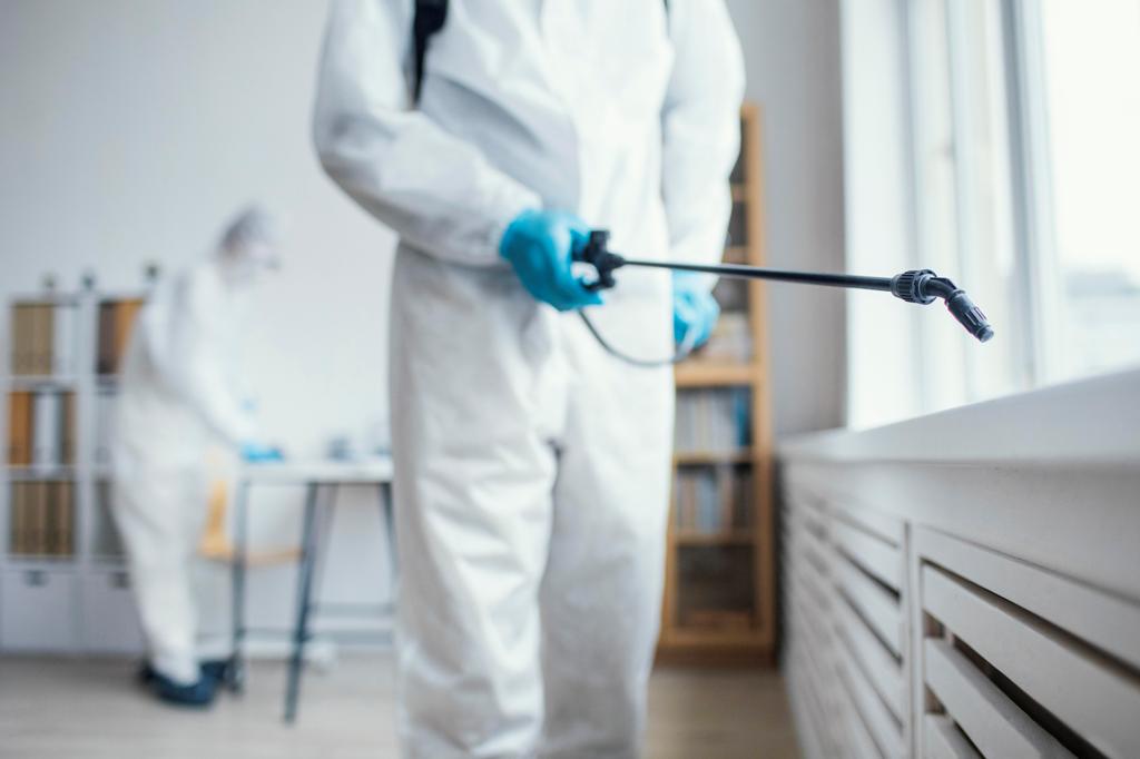 people-disinfecting-biohazard-area-sm